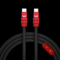 Coiled black USB-C to USB-C cable with red accents and brass pins